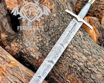 May include: A long, silver sword with a patterned blade and a gold crossguard. The handle is wrapped in gray material. The sword rests on a pile of brown logs. The text "FORGED GIFTS" is visible.