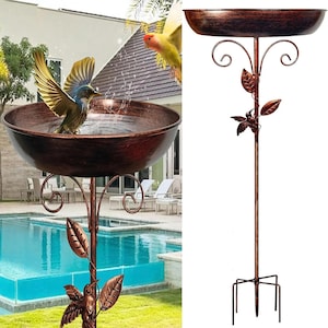 May include: A white ceramic mug with a black handle and the text "But First, Coffee" in a bold, black font. The mug is on a wooden surface. The mug is approximately 10 cm tall.