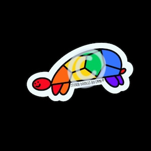 May include: A colorful sticker of a turtle with a rainbow shell. The turtle has a red head and feet, with the shell divided into sections of orange, yellow, green, and blue. The text "STICKER DOODLES BY EMMA" is printed on the sticker.