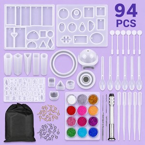 May include: A comprehensive resin art kit with molds, glitter, tools, and accessories. Includes various silicone molds in different shapes, glitter pots in multiple colors, mixing tools, and a black storage bag. The image shows the text "94 PCS".