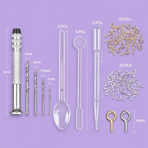 May include: A craft kit with various tools and accessories. Includes a 9cm hand drill, drill bits (1mm, 1.5mm, 2mm, 3mm), clear plastic spoons, stirrers, droppers, and eye pins (25 pieces each) in gold and silver.