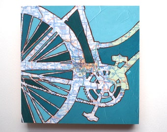 May include: A teal and blue abstract painting with a map of Minneapolis, Minnesota. The map is painted in a geometric style with teal and blue shapes.