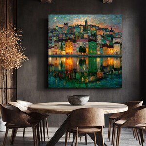 May include: A colorful cityscape painting depicts buildings along a waterfront at dusk. The artwork features a variety of building colors, including yellow, green, and red, with reflections in the water. A full moon is visible in the sky.