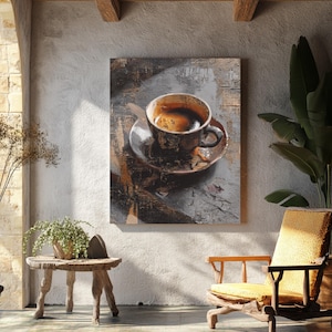 May include: A framed canvas art print featuring a close-up of a coffee cup and saucer. The cup is filled with dark coffee, and the artwork has a textured, abstract style with brown and gray tones. The print is displayed on a textured wall.