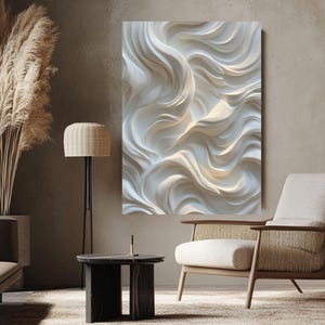 May include: A large, textured white wall art piece with a flowing, wave-like design. The artwork is mounted on a neutral-toned wall, creating a focal point in a modern living space. The piece is illuminated, highlighting the intricate details.