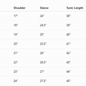 May include: A black and white sizing chart table with columns for Size, Chest, Waist, Shoulder, Sleeve, Tunic Length, Pant Waist, Inseam, and Cloak Length, listing measurements in inches for sizes ranging from XS to 4XL in a clear grid format.