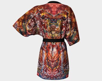 May include: A red, orange, and yellow patterned kimono robe with a black sash. The robe has a unique abstract design with a symmetrical pattern.