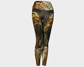 May include: Black yoga leggings with a high waist and a colourful abstract print featuring shades of orange, yellow, and brown.