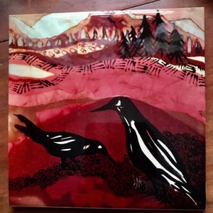 May include: Square ceramic tile with a glossy finish. The tile features a stylized landscape with two black and white birds in the foreground. The background shows a mountain range and trees in shades of red, brown, and blue.