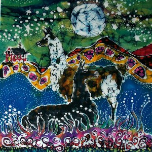 May include: A batik painting featuring three llamas in a landscape with a full moon. The llamas are white, black, and brown with intricate patterns. The background is a vibrant green, blue, and yellow with a red house in the distance.