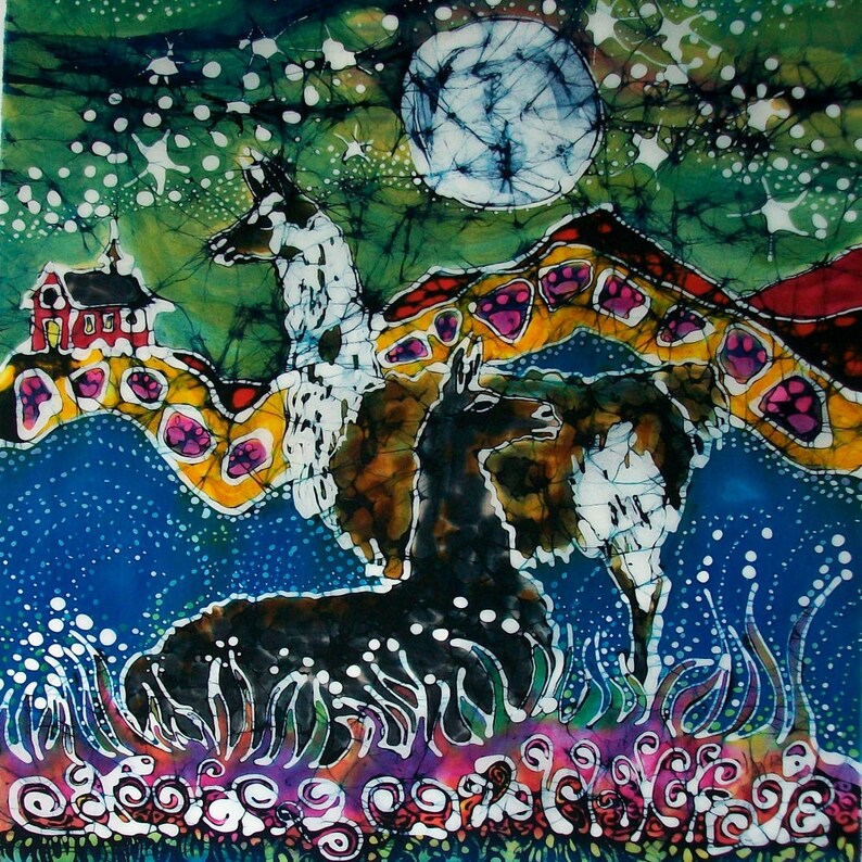 May include: A batik painting featuring three llamas in a landscape with a full moon. The llamas are white, black, and brown with intricate patterns. The background is a vibrant green, blue, and yellow with a red house in the distance.