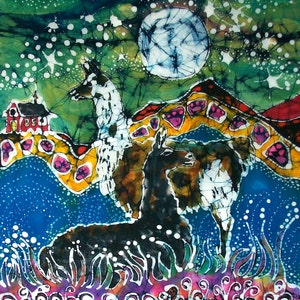 May include: A batik painting of two llamas standing in a field with a full moon in the background. The llamas are white and black with brown accents. The field is green with yellow and pink flowers. The moon is white with blue and black accents.