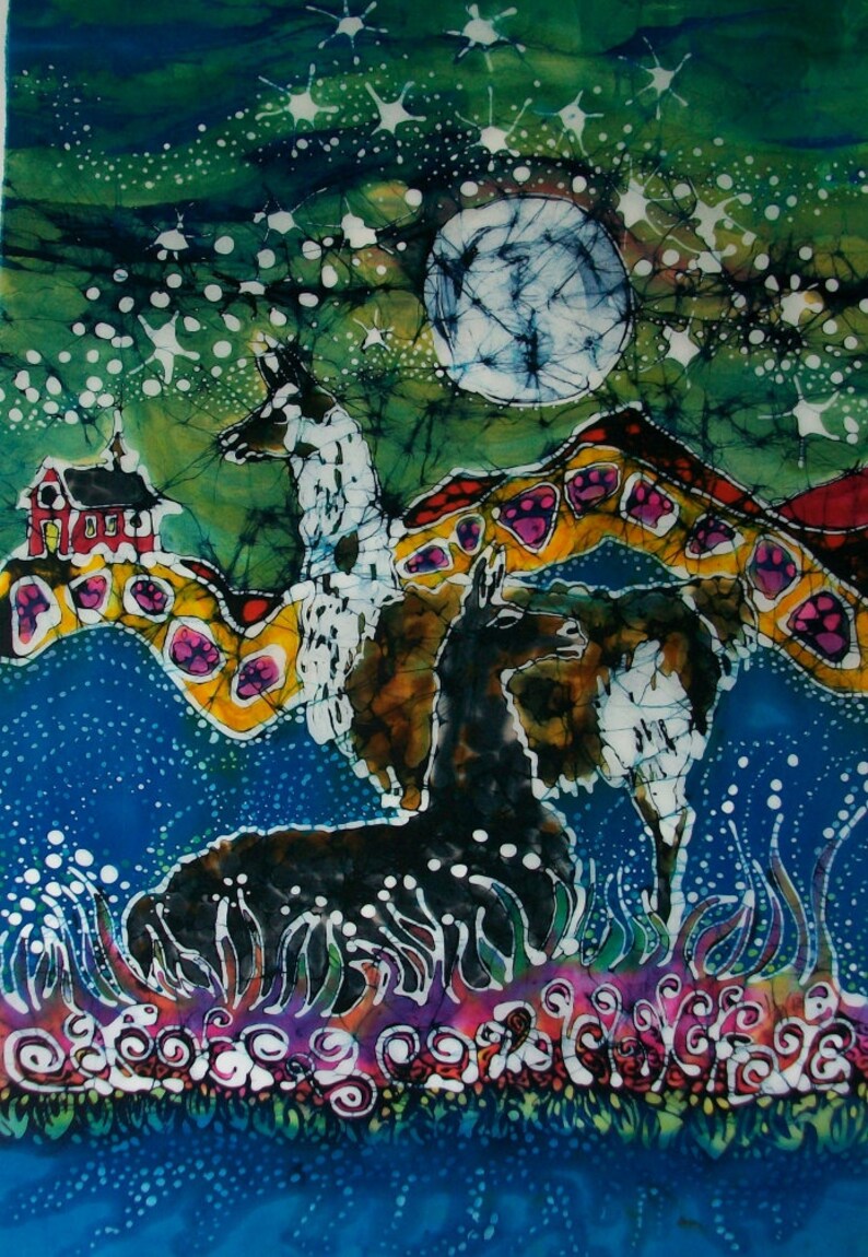 May include: A batik painting of two llamas standing in a field of flowers under a full moon and a starry sky. The llamas are white and black with brown accents. The background is a vibrant blue with green and yellow accents.