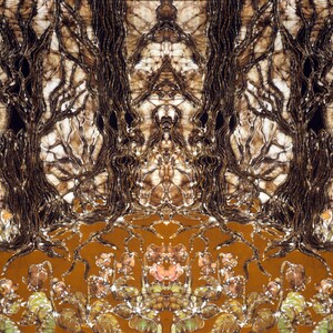 May include: A textile wall hanging featuring a symmetrical batik print of dark brown, gnarled tree trunks and bare branches against a cream background, with a solid ochre-colored base decorated with a repeating pattern of small, muted floral clusters.