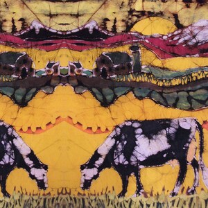 May include: A vibrant batik textile with a repeating pattern of cows grazing in a field. The design features a yellow background, green and brown hills, and a red and purple sky. The cows are black and white.