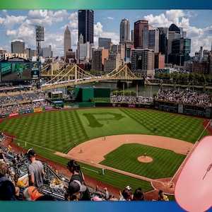 May include: A mousepad featuring a baseball field with a cityscape in the background. The field has a large "P" in the center. A pink computer mouse is in the lower right corner. The stadium is filled with spectators.