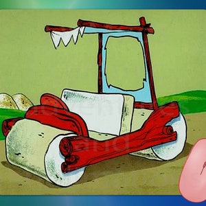 May include: A cartoon image of the Flintstones' car, a red and beige vehicle with large stone wheels and a wooden frame. The background is a green field with hills. A pink computer mouse is in the lower right corner.