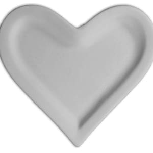 May include: A heart-shaped, light gray ceramic dish. The dish has a smooth, matte finish and a shallow, curved interior. The heart shape is symmetrical, with rounded edges and a pointed bottom. The dish is likely used for serving or display.
