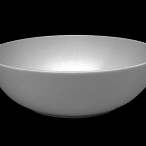 May include: A light gray, oval-shaped bowl with a matte finish. The bowl has a smooth, curved design and sits on a black background. This bowl is suitable for serving salads, soups, or other dishes.