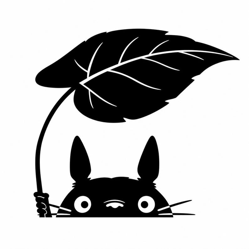 May include: A black and white graphic decal featuring a stylized creature with pointed ears and whiskers holding a large, broad leaf over its head. The design is flat, high-contrast, and minimalist, showing only the top half of the creature.