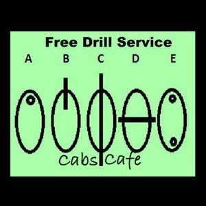 May include: A green background with the text "Free Drill Service" and the letters A through E. Below the text are five black oval shapes with different drill patterns. The text "cabs cafe" is written in cursive at the bottom.