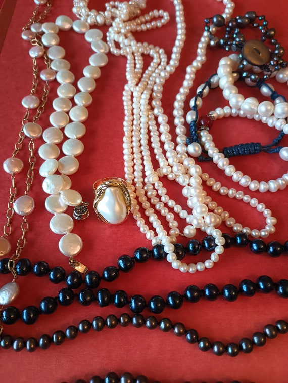 A lot of pearl jewelry. Grab a bag!