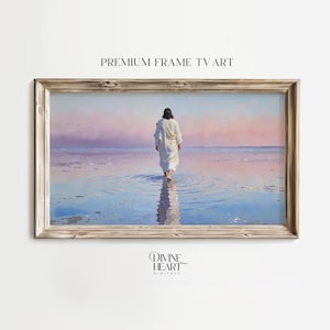 May include: A framed print of a person walking on water, with a serene sky in the background. The artwork is in a rectangular, light-brown wooden frame. The text "PREMIUM FRAME TV ART" is at the top.