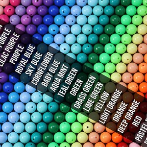 May include: A rainbow assortment of round, plastic beads in various colors, including watermelon, light purple, lilac purple, purple, royal blue, sky blue, cornflower, baby blue, aqua mint, teal green, green, grass green, lime green, yellow, light orange, orange, deep orange, red, pastel pink, and peach pink.