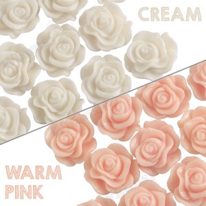 May include: Two rows of white and pink resin rose flower embellishments. The top row is labeled "CREAM" and the bottom row is labeled "WARM PINK".