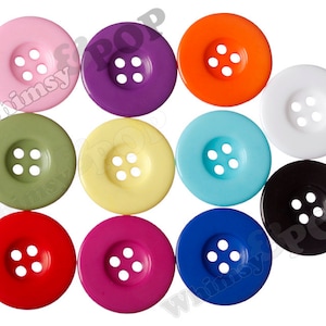 May include: Assortment of ten 4-hole plastic buttons in various colours, including pink, purple, orange, white, green, yellow, blue, black, red, and magenta.