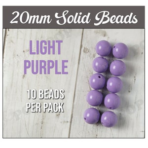 May include: Ten 20mm light purple solid beads.  20mm Solid Beads LIGHT PURPLE 10 BEADS PER PACK