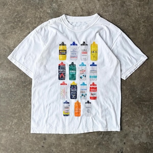 May include: White t-shirt featuring a colorful graphic of various water bottles, each with a unique design and team logos. The bottles are arranged in a grid pattern across the front of the shirt. The shirt has short sleeves and a crew neck.