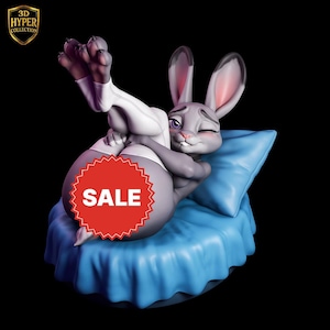 May include: A gray bunny figure winking, wearing white clothing, and lying on a blue pillow. A red "SALE" sticker is on the figure. The figure is part of the "3D HYPER COLLECTION".