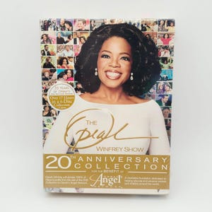 May include: The Oprah Winfrey Show 20th Anniversary Collection DVD set. The cover features Oprah Winfrey with a collage background. The set includes over 17 hours of content on 6 discs. The collection benefits Oprah's Angel Network.