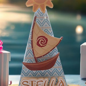 May include: A party hat with a sun-shaped topper and a sailboat design. The hat is decorated with a blue and white geometric pattern and the name "STELLA" in layered lettering. The sailboat has a tan sail with a red spiral.