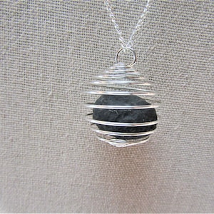 Saffordite in Stainless Steel Spiral Cage pendant/6.08 grams/Grade A/Cintamani Stone/ Tektite/ Energy Stone/Talisman/light Catcher #2