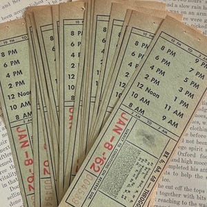 May include: A collection of vintage transit tickets with a beige background. The tickets display times from 3 AM to 10 PM, with dates and numbers printed in red. The text "JAN - 8 - '62" is visible on several tickets.