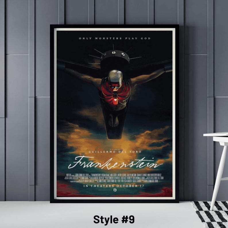 May include: Framed movie poster for "Frankenstein" by Guillermo del Toro. The poster features a dark, dramatic image of a figure with a red ribcage and a helmet, with the text "ONLY MONSTERS PLAY GOD" at the top. The movie title is in a stylized font.