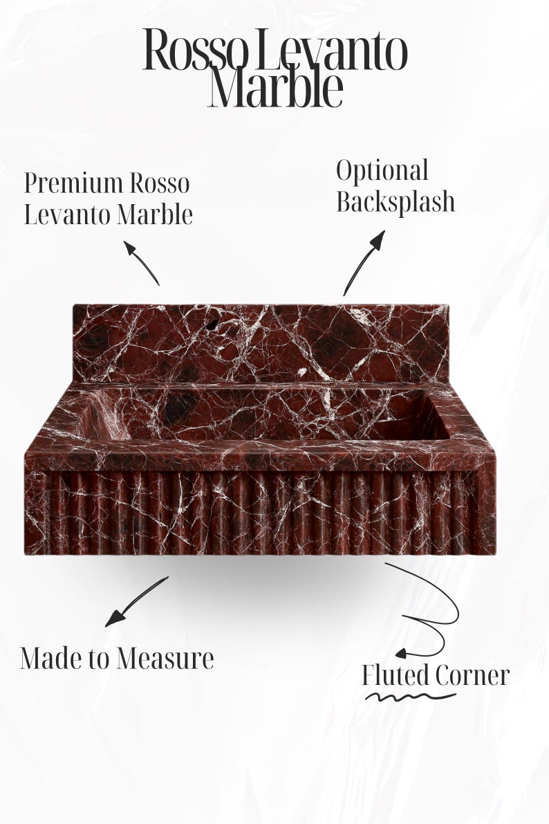 Deep red marble wall-mounted basin in Rosso Levanto marble, designed for luxury modern bathrooms.