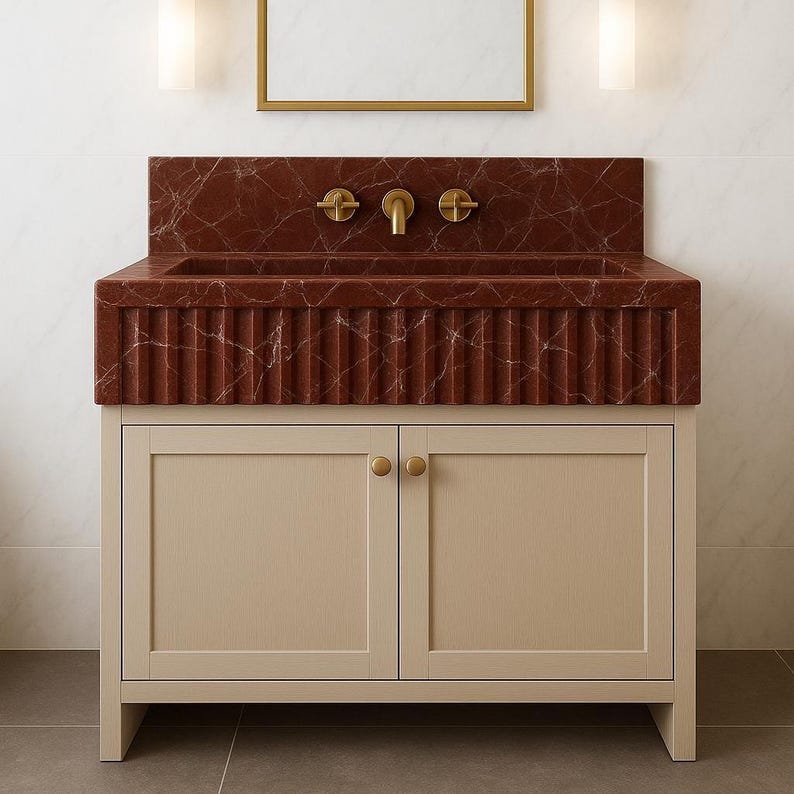 Handcrafted Rosso Levanto marble vanity sink with deep burgundy tone and polished fluted texture.