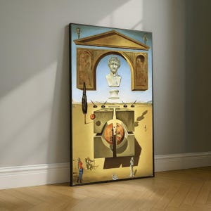 May include: Framed surrealist artwork featuring a bust of a man within an archway, set against a blue sky. The painting includes geometric shapes, a tree, and figures in a desert landscape. The artwork is in a black frame.