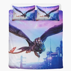 May include: Bedding set with a dragon and two people soaring above a city. The set includes a duvet cover and two pillowcases. The dragon is black with green eyes, set against a purple and blue sky.