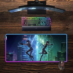 May include: A gaming setup featuring a curved monitor, a rainbow-lit keyboard, and a large mousepad with a futuristic cityscape and anime characters. A matching mouse is also visible. The setup is on a wooden surface.