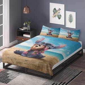 May include: A blue and white bed set featuring a cartoon character on a beach scene. The set includes a fitted sheet, two pillowcases, and a comforter. The comforter and pillowcases have a blue sky and ocean background.