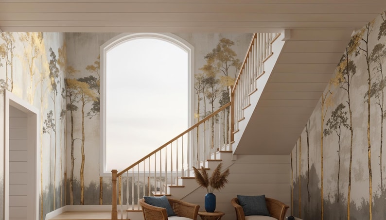 May include: Interior scene featuring a staircase with a wooden banister and white risers. The walls are adorned with a mural of stylized trees in gold and gray tones. Two wicker chairs with blue cushions are placed near the stairs.