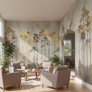 May include: A modern living room with large windows and a mural featuring gold and gray trees. The room includes four beige armchairs, a round wooden coffee table, and potted plants. The walls are painted in neutral tones, creating a serene atmosphere.
