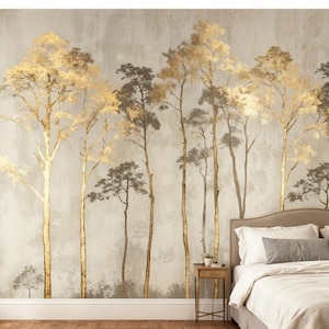 May include: A bedroom with a mural featuring stylized trees in gold and gray tones. The trees have slender trunks and full, textured canopies. The room includes a bed with white bedding, a side table, and a chair.