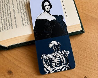 May include: A rectangular bookmark featuring a portrait of Mary Shelley in black and white on a light blue background at the top, and a dark blue section at the bottom with a white anatomical heart illustration and the text Mary Shelley in white.