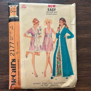 May include: Vintage McCall's 2177 sewing pattern for Misses' robes and nightgowns in two lengths. The pattern envelope features illustrations of the garments in pink and teal. The envelope is marked "New Easy" and includes a two-color guide.