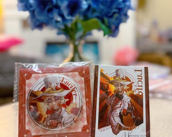 May include: Two items on display: a round pin and a rectangular card. Both feature an illustration of a character in a white coat and hat, with the name "Lucifer" and "Morning Star" printed on them. The pin is in a red and white checkered pattern.